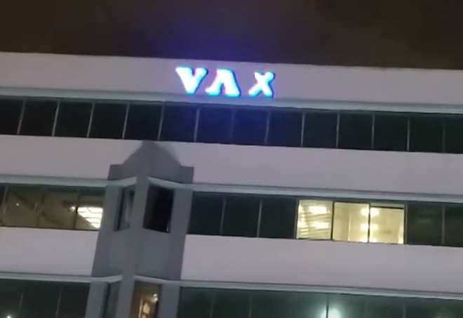 "Vax the Jews" flashed in front of NYE revelers in downtown Orlando - Screen capture courtesy WKMG/YouTube