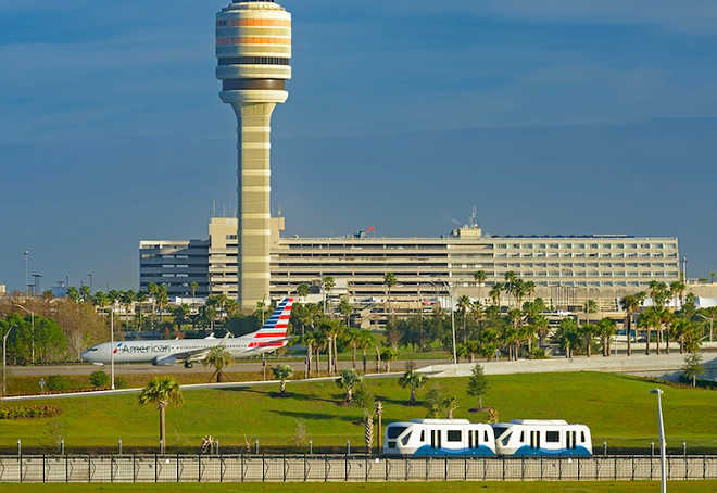 A view of MCO including the air traffic control tower and the monorail. - image via Orlando International Airport