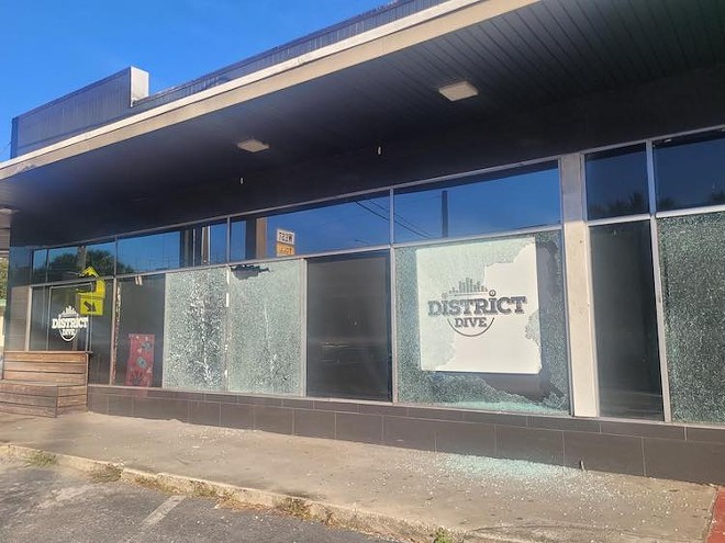 The windows of LGTQ bar District Dive were shot out early Wednesday morning - Photo by Blue Star