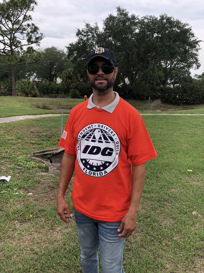 Adalberto Perez, an Uber driver in Orlando, who's organizing with other local rideshare drivers for better pay and app policies. - photo by McKenna Schueler