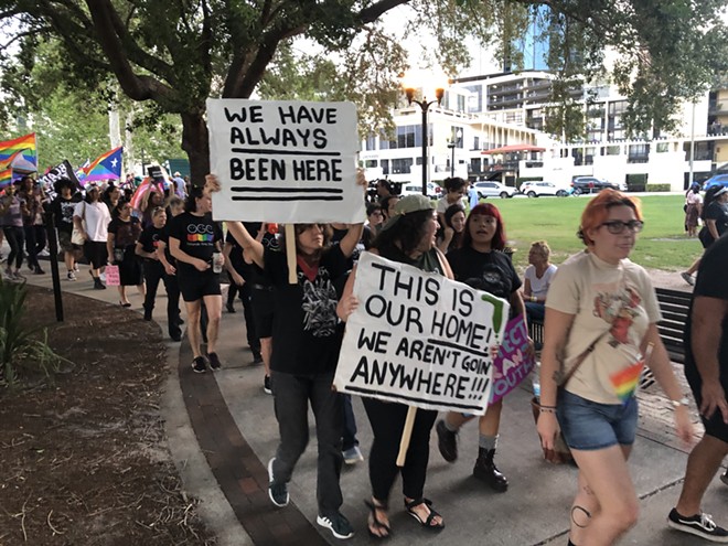 Floridians march in support of LGBTQ+, immigrant and worker rights at May Day rally in Orlando. - McKenna Schueler