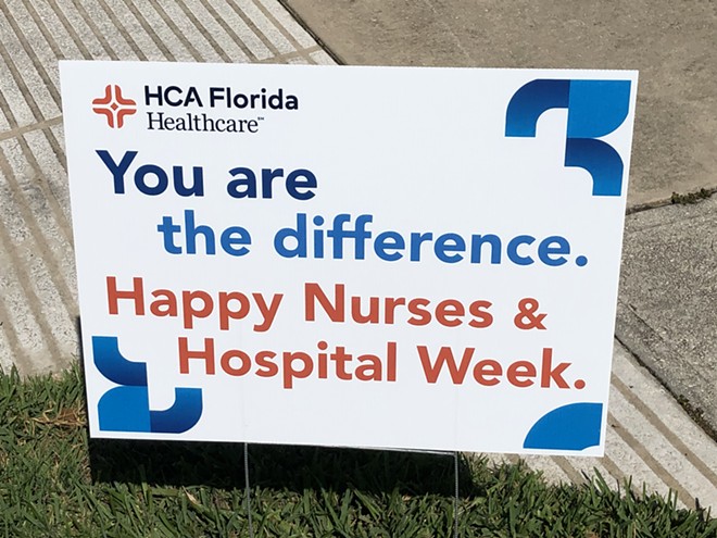 Sign posted outside HCA Florida Osceola Hospital, the same day workers held a rally over staffing concerns, May 10, 2023. - photo by McKenna Schueler