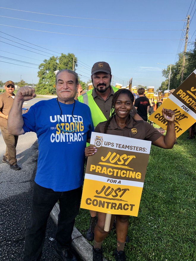 UPS Teamsters in Orlando (from left to right: Walt Howard, John Gregory, and April Hope) practice their picket line ahead of what could be one of the largest work stoppages in U.S. history. July 13, 2023. - photo by McKenna Schueler