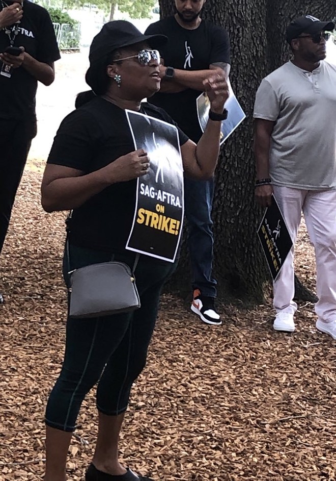 Carol Bailey, vice president of the SAG-AFTRA Miami Local board, speaking at a rally in Orlando in support of a fair contract. Aug. 10, 2023. - McKenna Schueler