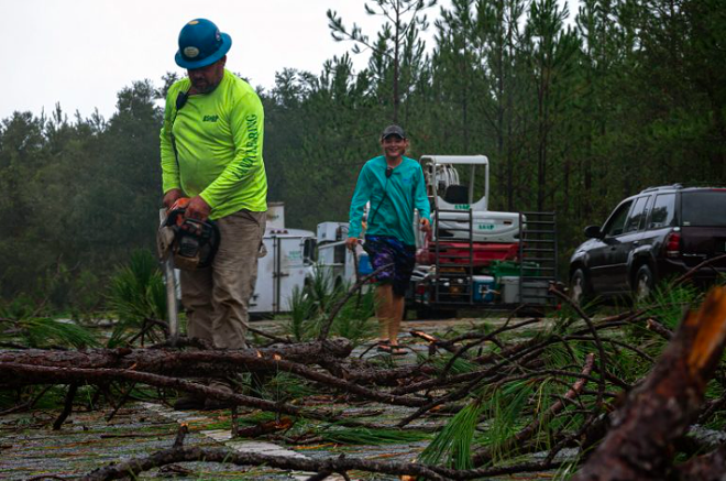 Workers for A.S.A.P. Tree and Fence clear State Road 51 of debris outside of Steinhatchee, Fla., following Hurricane Idalia’s landfall in Keaton Beach Wednesday morning, Aug. 30, 2023. - Photo by Augustus Hoff/Fresh Take Florida