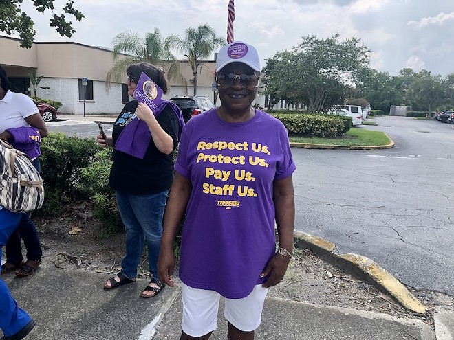 Diane McMullen, a CNA at Aspire at Rosewood and union member, pickets alongside her fellow staff and union members (Aug. 8, 2024) - photo by McKenna Schueler