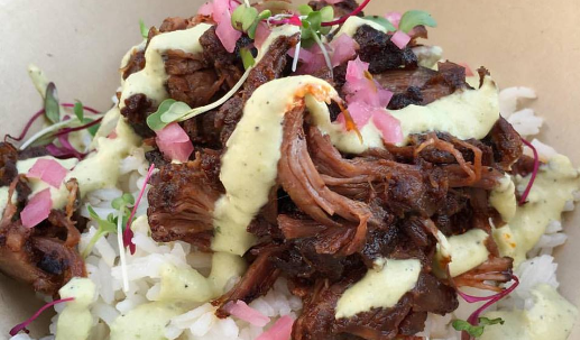 Braised short rib over rice with pickled onions and aji verde. - IMAGE COURTESY PAPA LLAMA