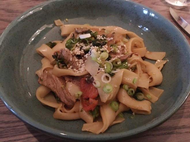 Szechuan manzo (beef) with rapini, romanesco, lotus root, and rice noodle tagliatelle