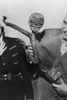 Robert Ripley with the "Fiji Mermaid", which turned out to be a hoax consisting of a monkey torso attached to a fish.