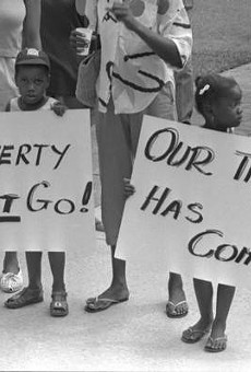 Two children protest poverty in Tallahassee in 1987.