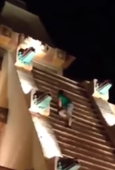 Watch this extremely drunk man climb Epcot's Mexico Pavilion