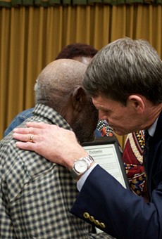Groveland Mayor Tim Loucks hugs a relative of the Groveland Four.