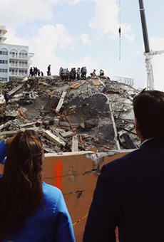 Florida Gov. Ron DeSantis looks at the rubble of the Champlain Towers collapse.