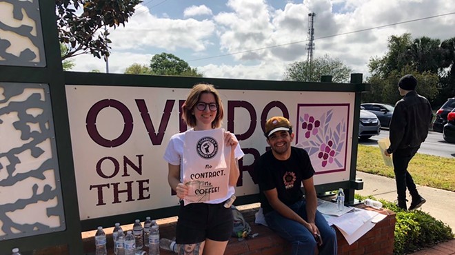 Courtney Thompson (left) stands on the picket line with fellow Starbucks workers at Central Florida's only unionized Starbucks on March 22, 2023.