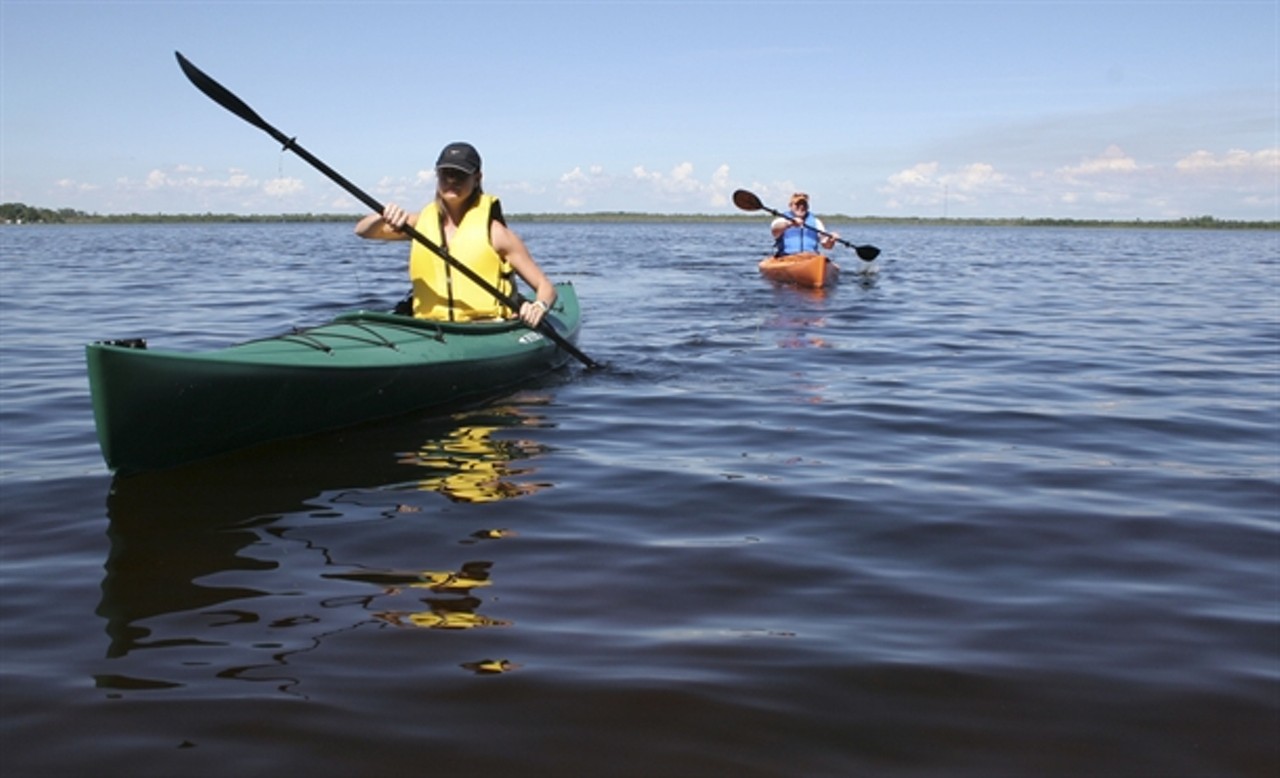 There are probably tons of alligators in the waters where these kayakers are paddling (via visitcentralflorida.org)