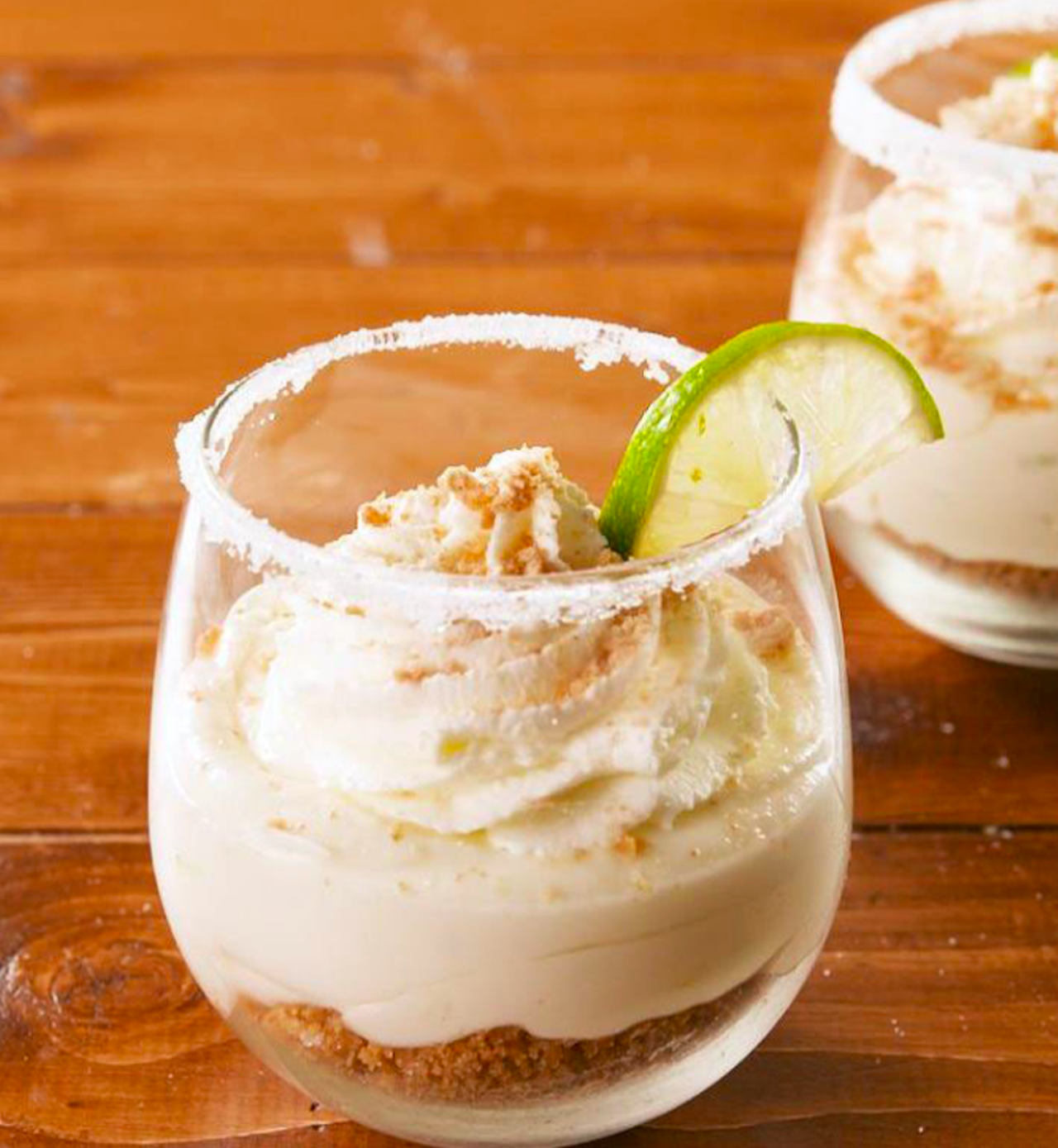 Margarita Cheesecake Mousse
Looking for a brunch treat with a little pizzazz? This boozy cheesecake mousse is a citrusy
delight. With a crust made of crushed graham crackers, melted butter, and sugar and a creamy filling infused with Casa
Del Sol Blanco, lime juice and zest - your taste buds will be begging for more. Add a touch of flair with a lime and sugar
rim, and you'll have a deliciously impressive dish to serve to your guests.
The Recipe:
- Crust*
- Cheesecake mousse**
- Lime wedges
- ¼ cup granulated sugar
- Whipped cream
- Crushed graham crackers
Crust*
- 9 graham crackers, finely crushed
- 5 tablespoons melted butter
- 2 tablespoons granulated sugar
Cheesecake mousse**
- 2, 8-ounce cream cheese packages, softened
- 2 cups powdered sugar
- 3 tablespoons Cas Del Sol Blanco Tequila
- 1 lime, juiced and zested
- 1 teaspoon vanilla extract
- 1/3 teaspoon kosher salt
- 1 cup whipped cream
For the crust: In a medium bowl, combine crushed graham crackers, melted butter and sugar together. Stir to
combine and set aside.
For the cheesecake mousse: In a large bowl, beat cream cheese and powdered sugar until smooth. Add tequila,
lime juice and zest, vanilla extract, salt and beat until incorporated. Fold in whipped cream. Transfer cheesecake
mousse to piping bag.
For the completed dessert: Run a lime wedge around 6 glasses and place sugar in a small plate. Dip rim of
glasses into sugar to coat. Divide graham cracker mixture between glasses and lightly pack with spoon, then pipe
cheesecake mousse over the crusts. Refrigerate until chilled, at least 1 hour and up to overnight. When ready to
serve, top with whipped cream, crushed graham crackers and a lime wedge.