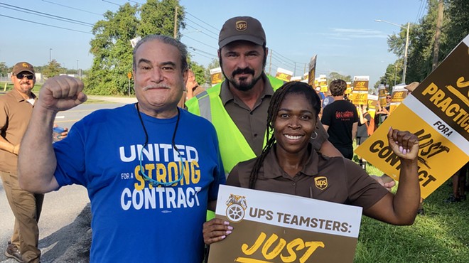 UPS Teamsters in Orlando (from left to right: Walt Howard, John Gregory, and April Hope) practice their picket line ahead of what could be one of the largest work stoppages in U.S. history. July 13, 2023.